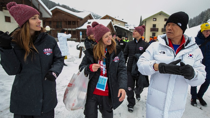 Lauren Bendict and Lauren Weibert watch Korean leader as he speaks